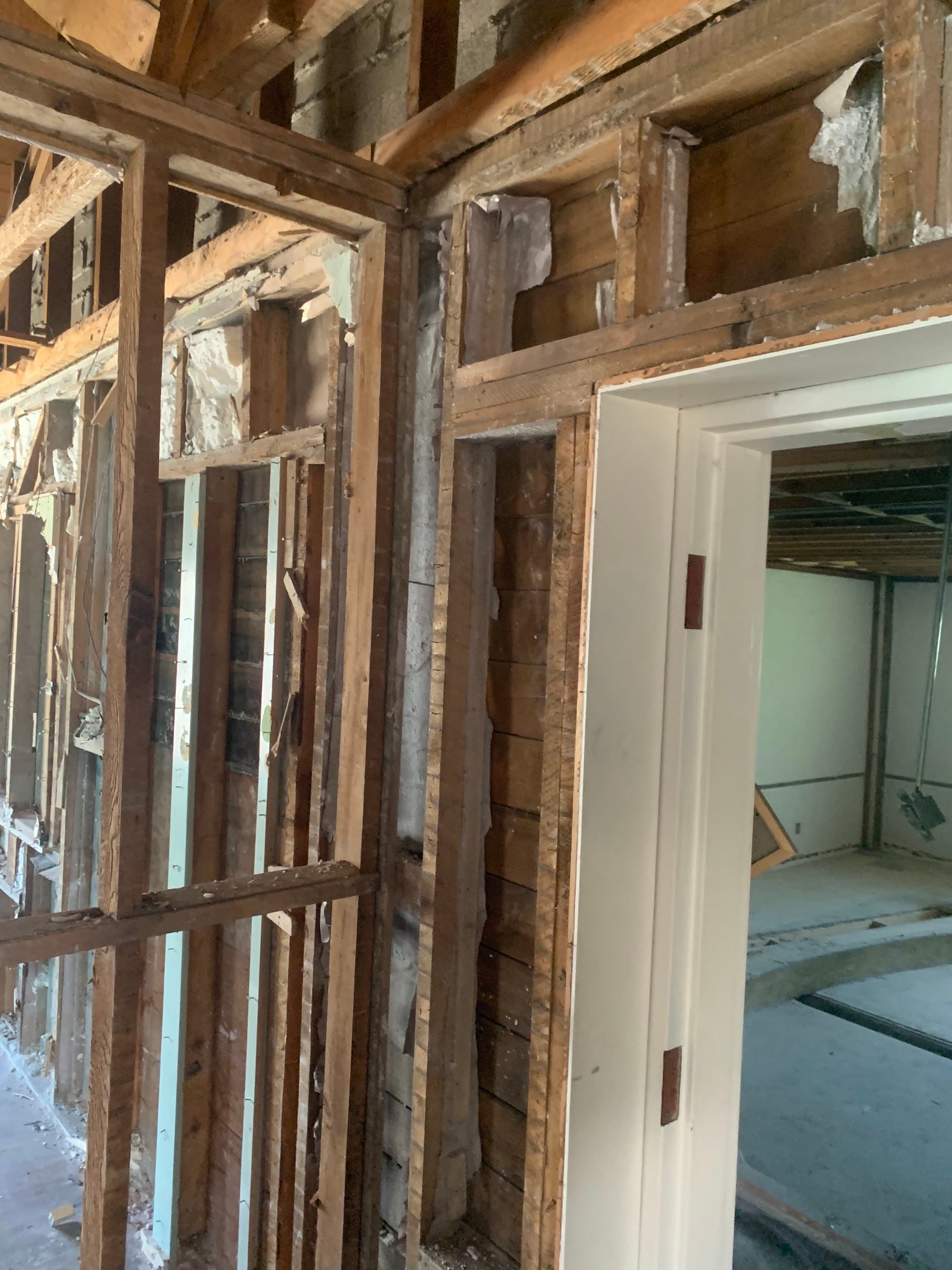 Signs of structural damage in a residential building — cracked foundation and wall separation