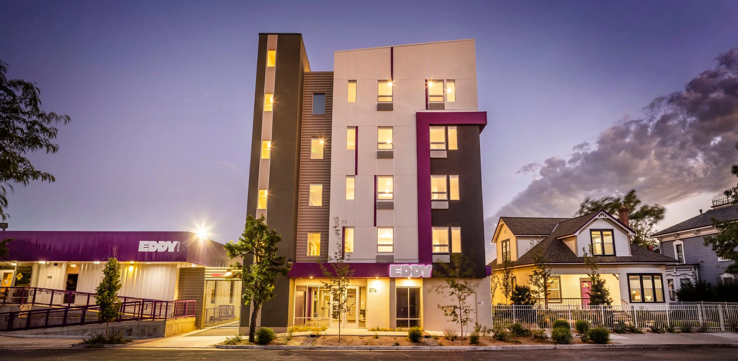 Eddy House TLC — alternate panoramic angle showing concrete podium and wood frame upper stories